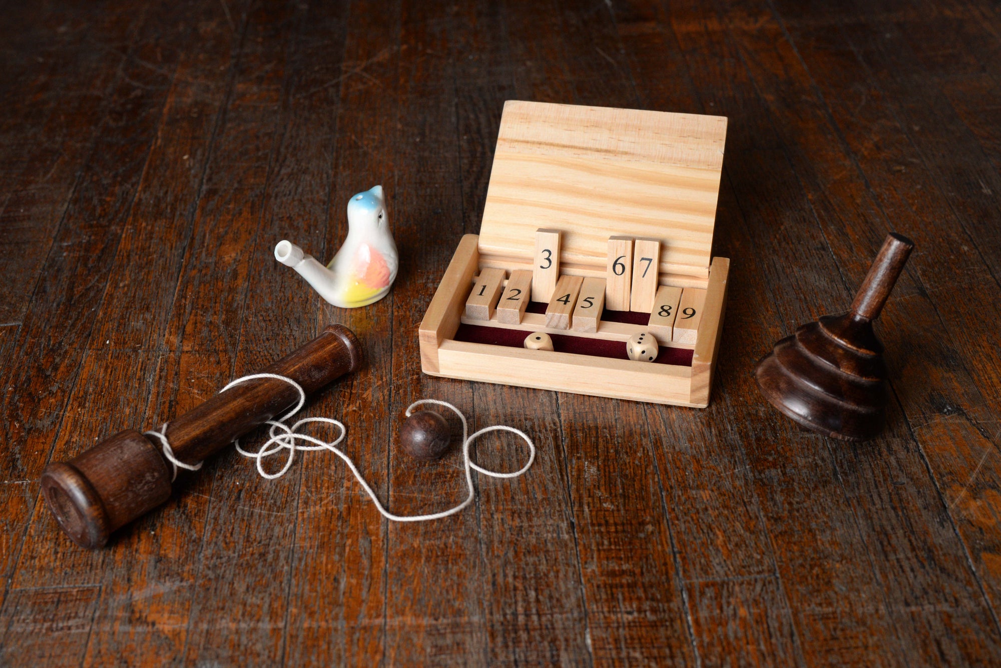 18th Century Game Bundle - shut the box, bird whistle, spinning top, and ball and cup