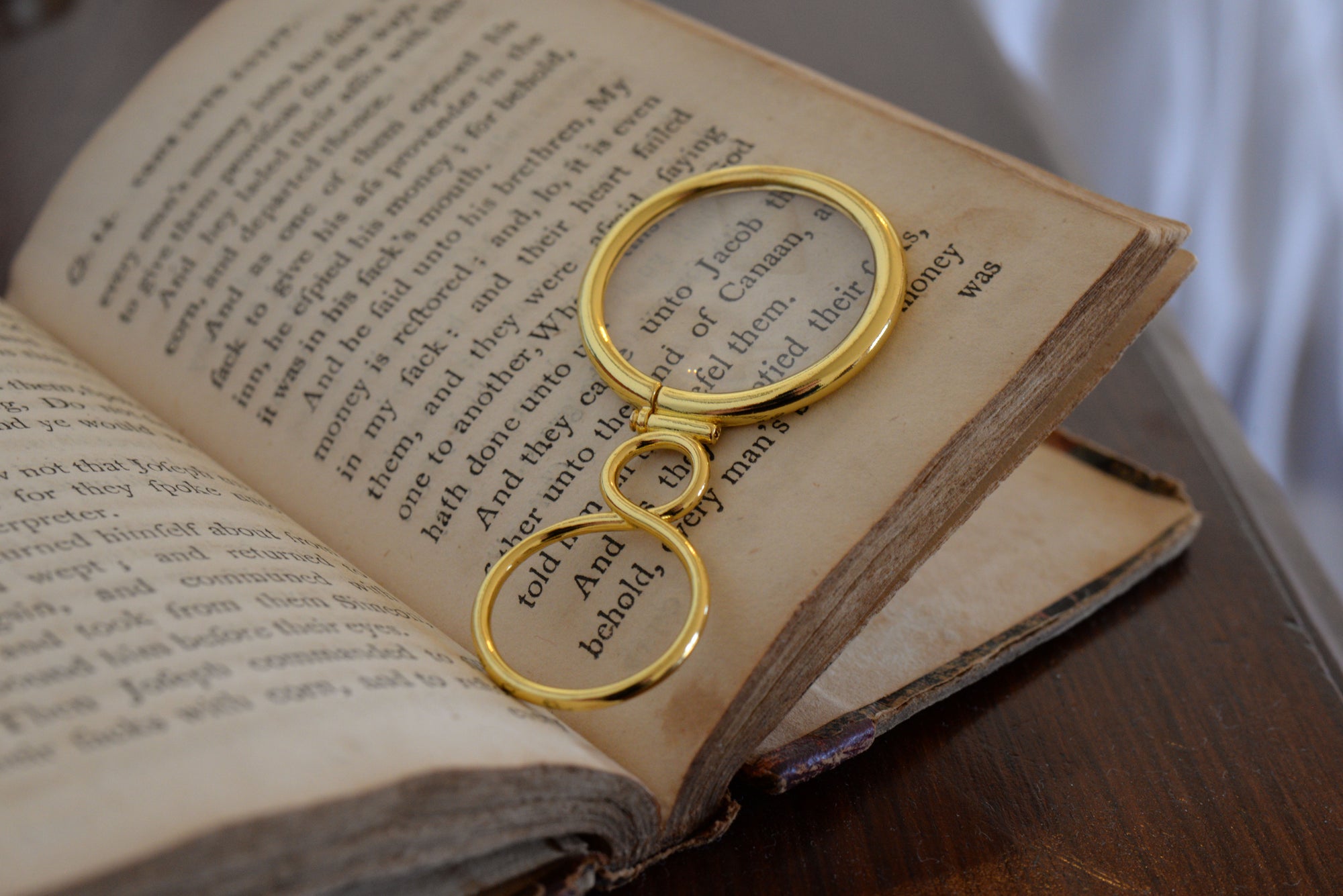 magnifying glass on 18th century book